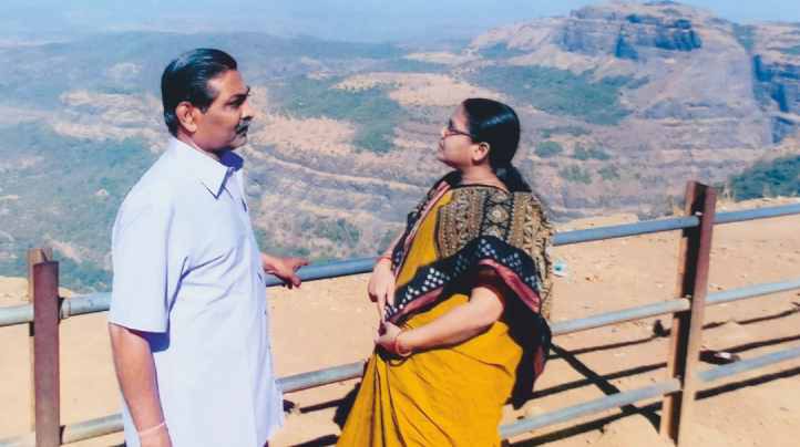 With his wife, travelling
